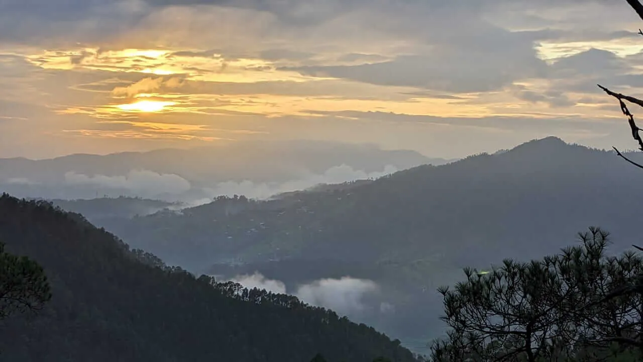 Golden sunset over the layered Kumaon valleys